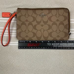Orange and tan double zip large wristlet
